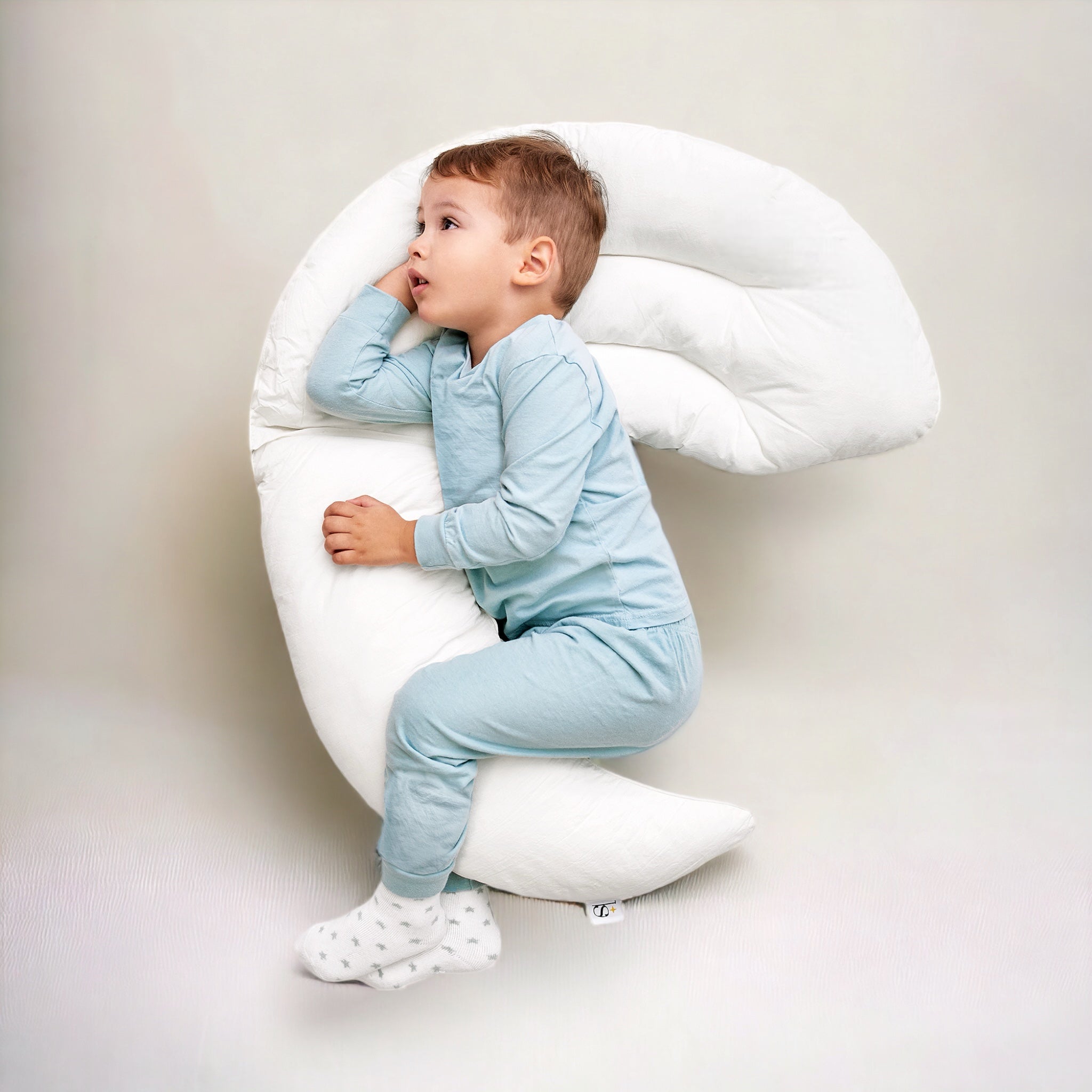 Almohada media luna para bebes sale